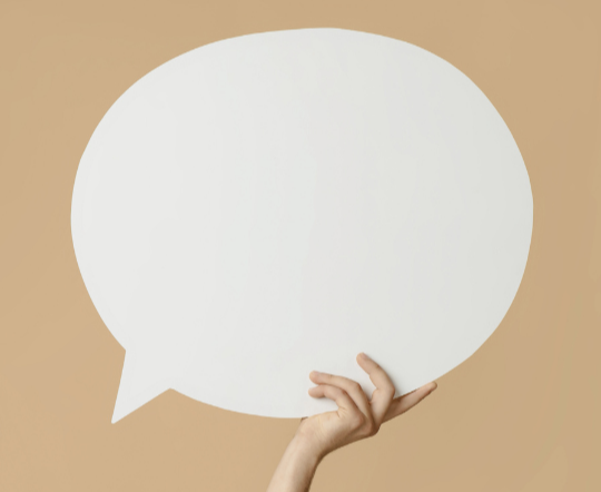Image of a person holding a comment bubble.