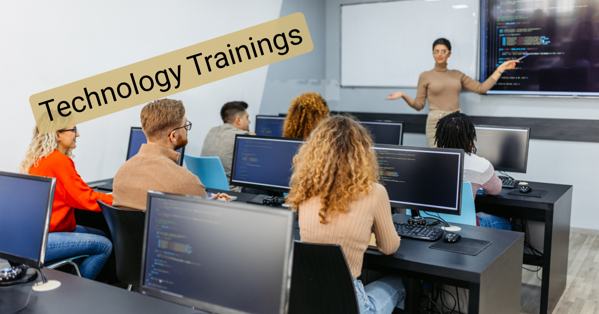 Image of adults in a classroom learning about technology.