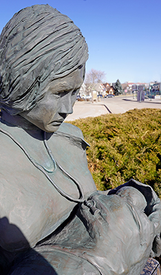 Bronze statue by Jess E. DuBois at the Light Rail Station at E 30th Ave and N Downing St.