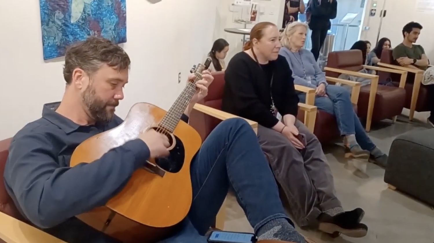 Performer playing guitar at Jamschutz
