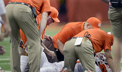 AJC injured football player and coaches