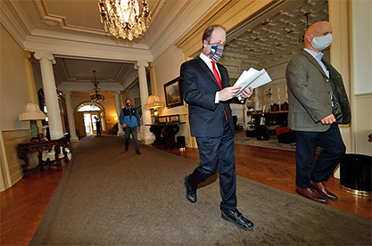 Gov. Polis walks through Capitol