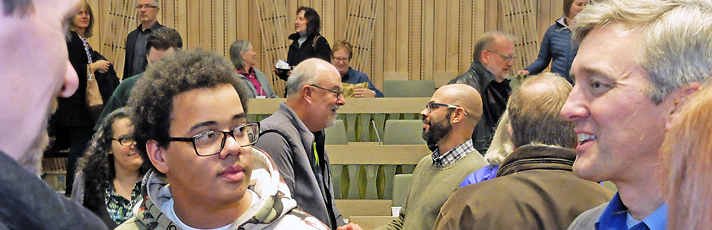 People talking after a speech