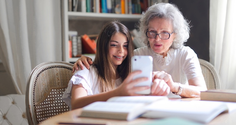 Grandparent and child planning at table-photo credit Andrea Piacquadio