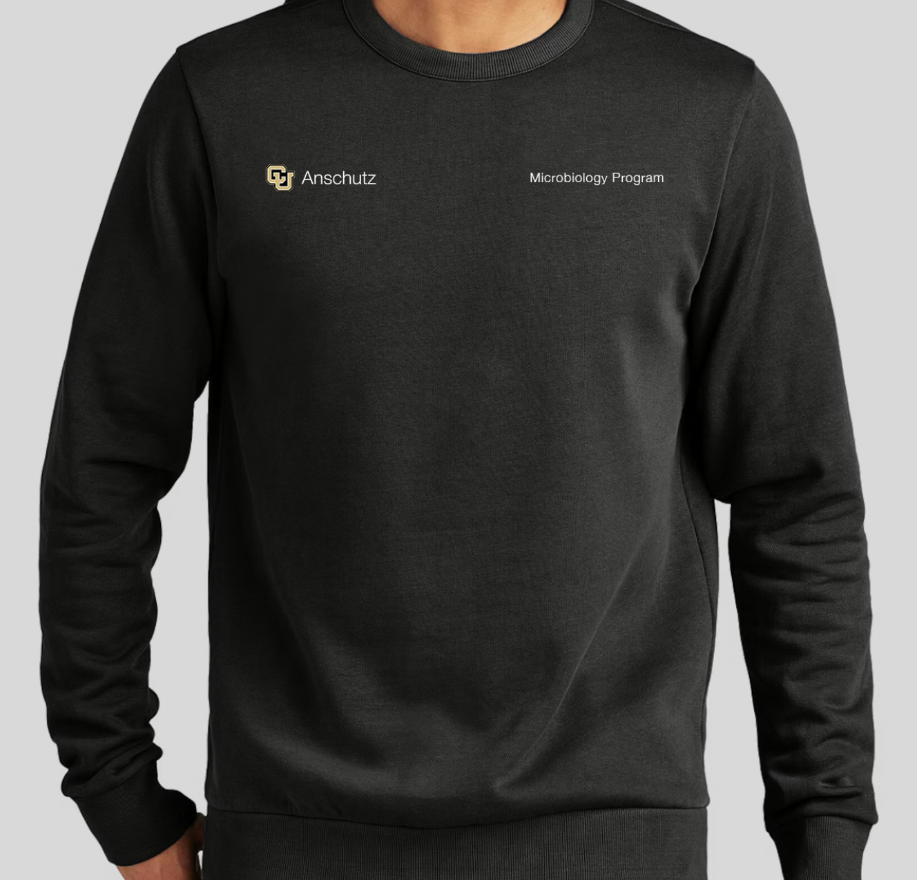 Mockup of a crewneck with CU Anschutz and Microbiology program written on it