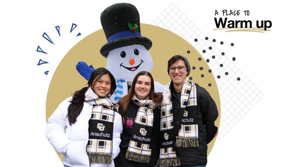 three people wearing winter gear posing with an inflatable snow man. The upper right corner reads 'A Place to Warm Up'