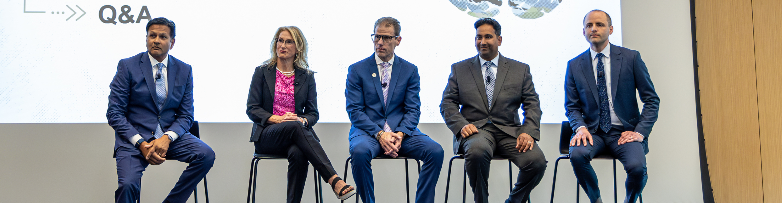 five panelists on a stage