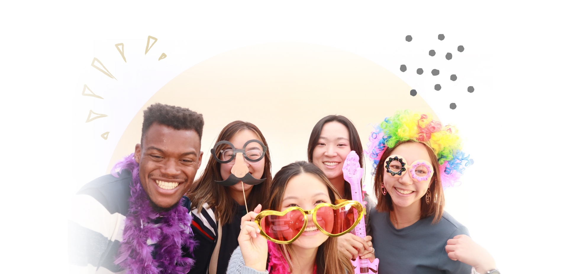 group of students wearing silly props for a photo