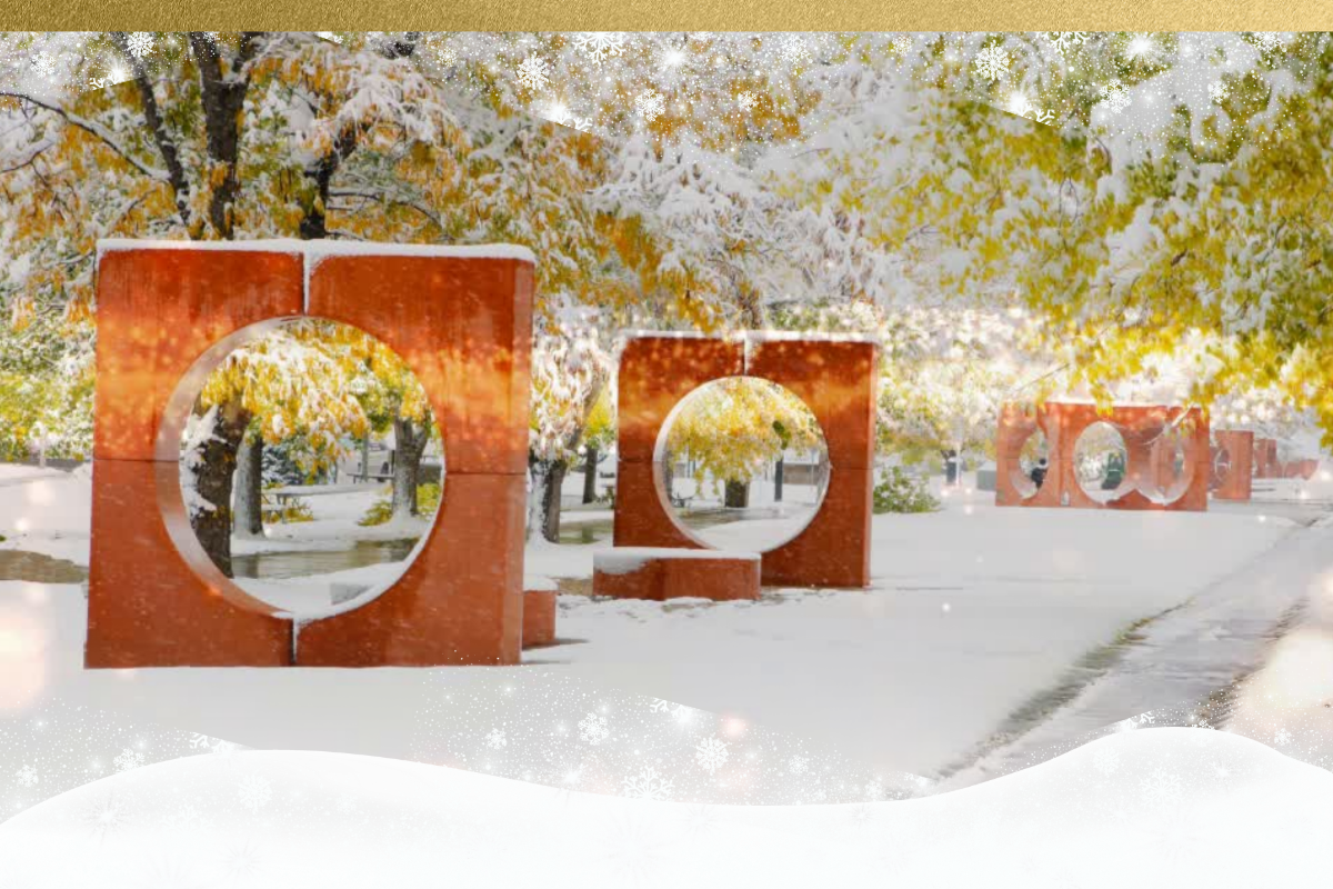 A snowy CU Anschutz campus with gold and snow graphics