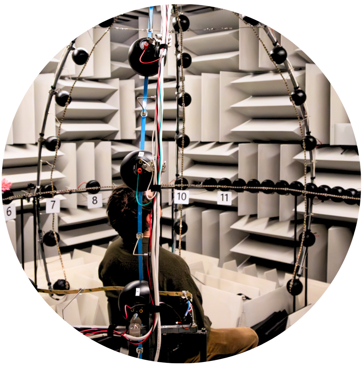 man sitting in an auditory research lab