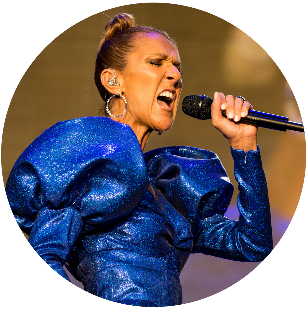 Celine Dion singing in a blue dress