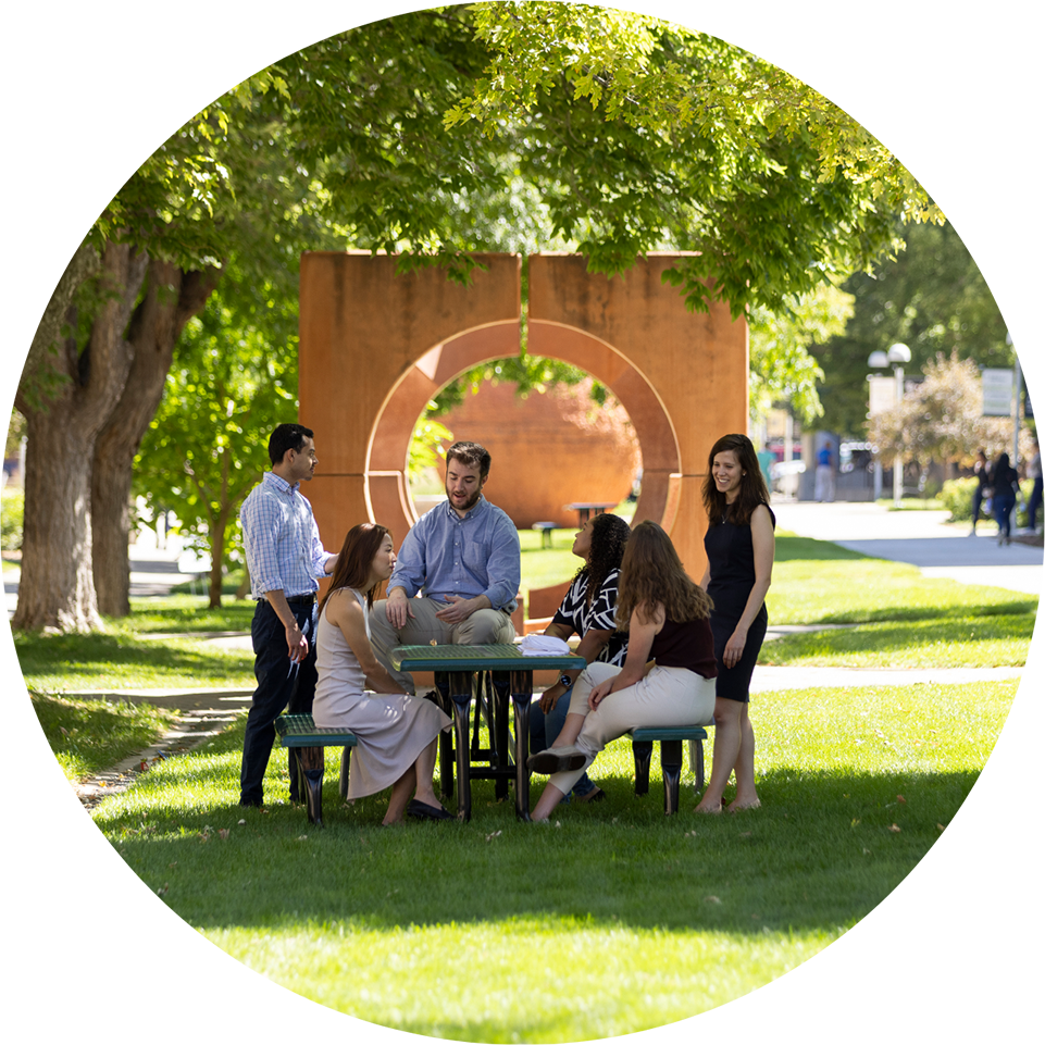 Student sitting at a picnic table