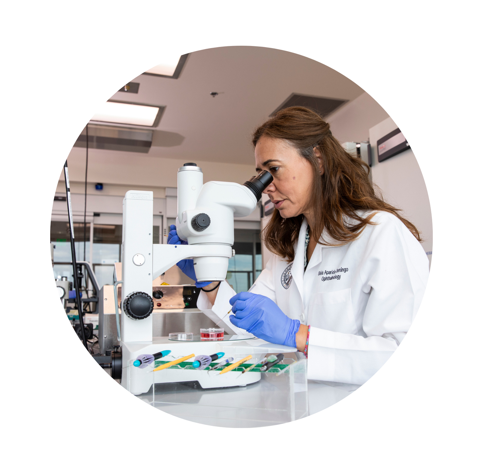 Woman looking through microscope