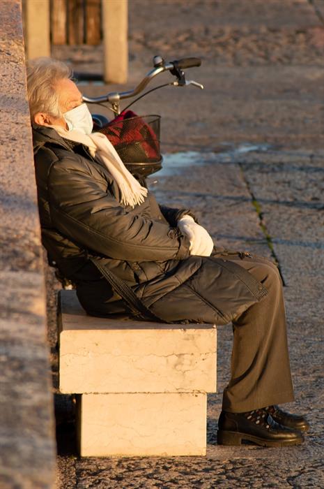 woman sleeping on a bench