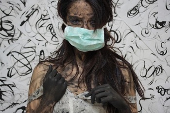 Painted person in surgical mask Painted person in surgical mask