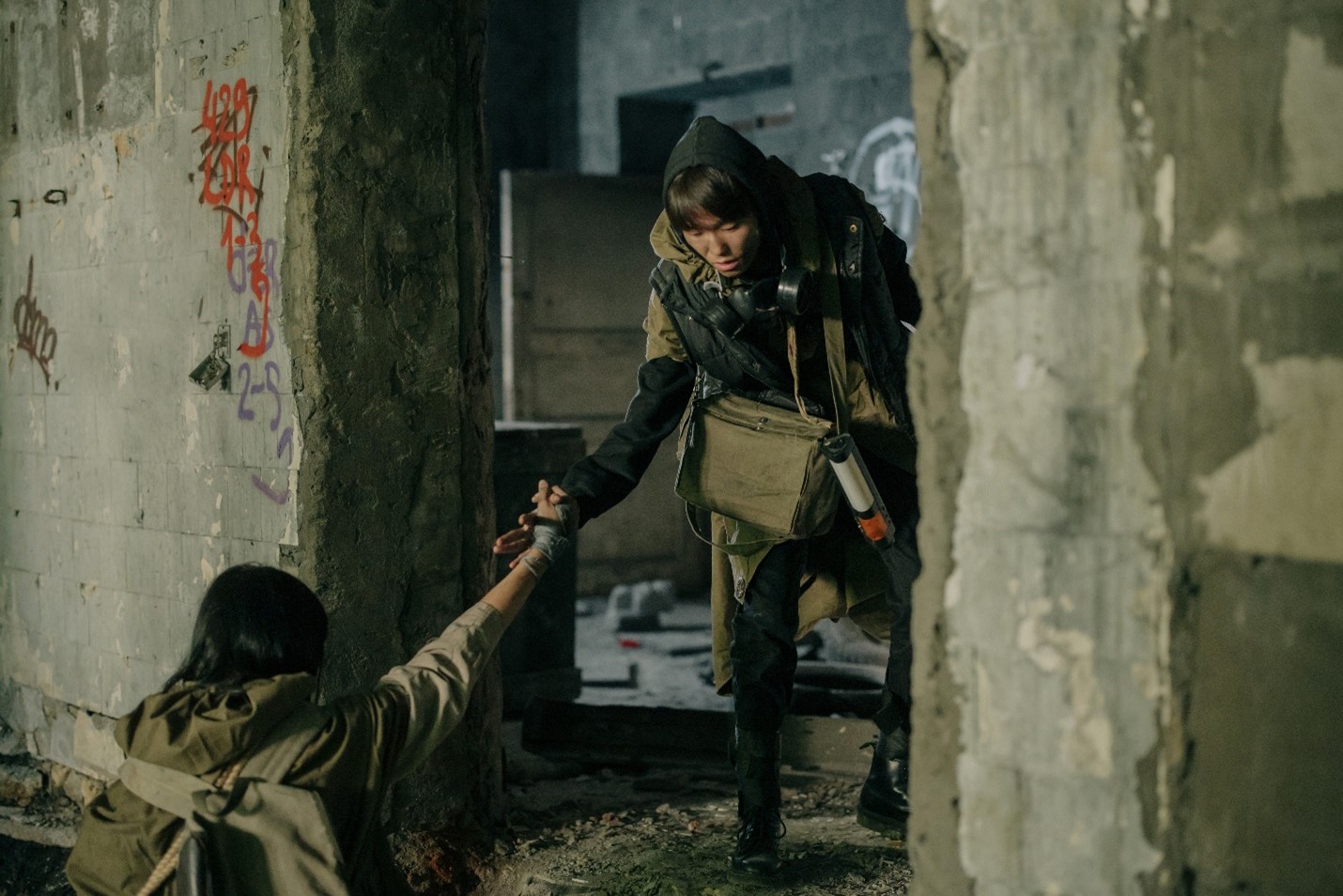 Person helping someone stand up