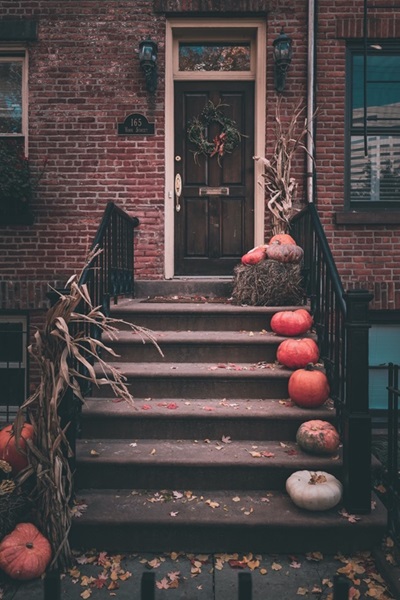 Porch with pumpkins on steps