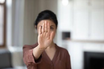 Woman with hand up