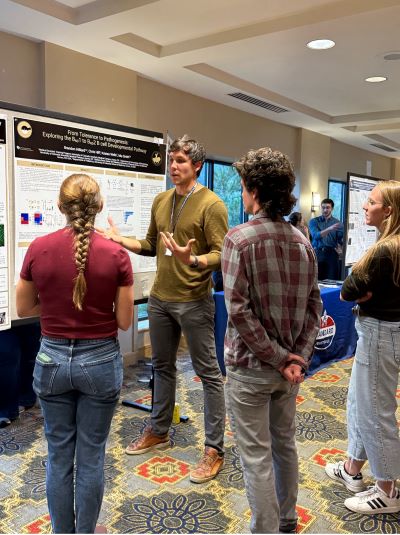 Immunology program representative presenting a poster