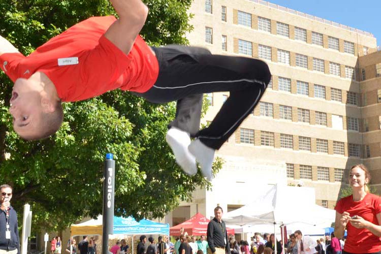 a student performing a backflip