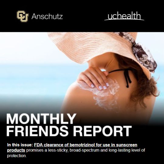 Monthly Friends Report: A woman wearing a wide-brimmed sun hat applies sunscreen to her shoulder.
