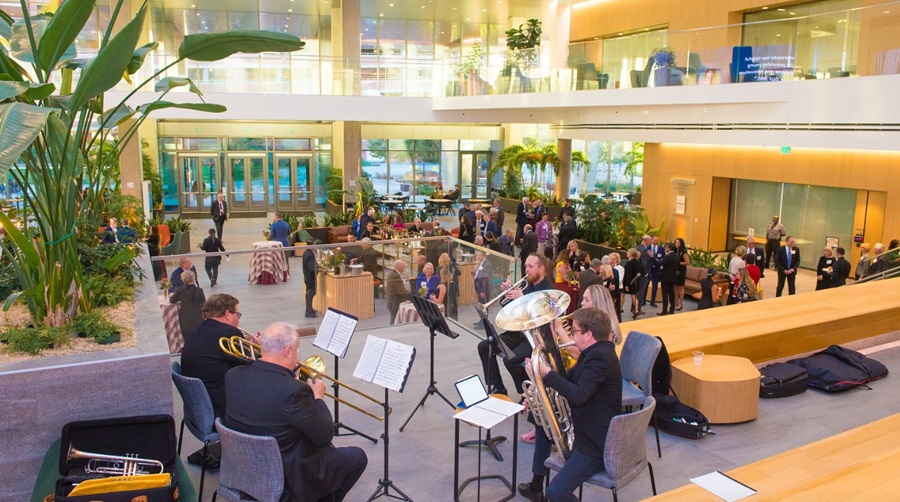 The Colorado Symphony Orchestra performs to gusts mingling in the Benson Atrium before the 2025 Endowed Chair Celebration program officially begins.