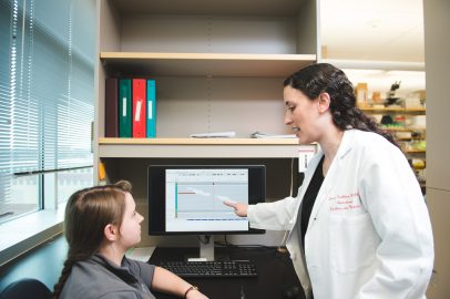 Lauren Fishbein talking with patient
