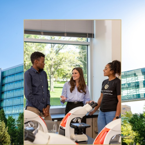 CU Anschutz medical students speaking in a lab on campus