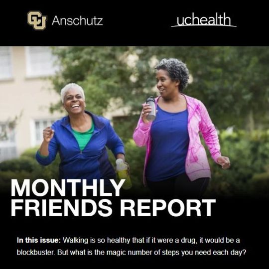 Monthly Friends Report: Two women engage in fun conversation while power walking and holding water bottles.