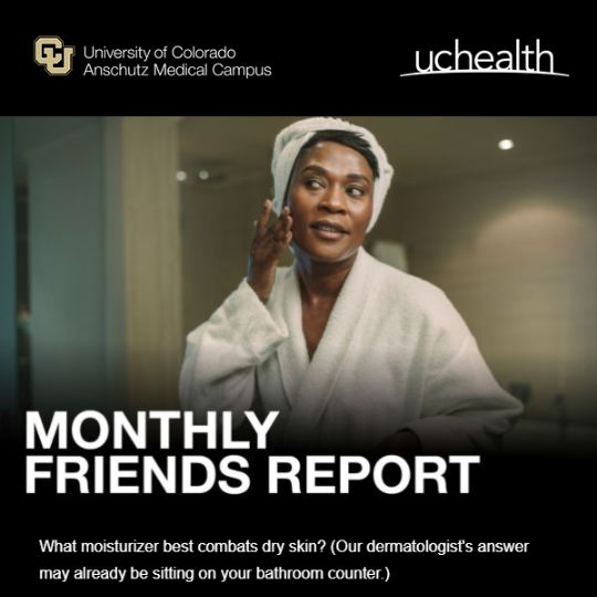 Monthly Friends Report: A woman in a white bath robe and hair towel smiles at her reflection while applying face lotion.