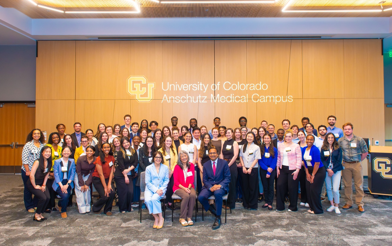 Group photo taken during the 2026 School of Medicine Scholarship and Awards Celebration of all students, Vicki Sakata, Dr. Zimmer and Dr. Mandava.
