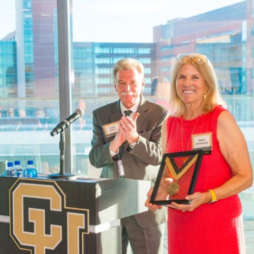 SOC Article Feature Image - Debra Devereaux Debra Devereaux accepts her commemorative medallion during the endowed chair celebration event.