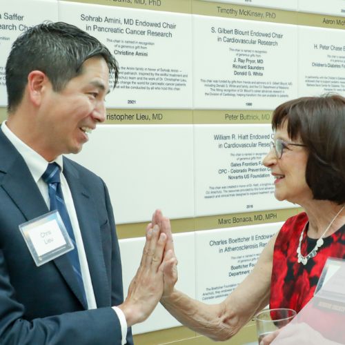 SOC Article Feature Image C3 40 Years of Progress Chris Lieu, MD, the CU Cancer Center's associate director of clinical research, celebrates with benefactor Chris Amini.