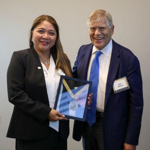 SOC Article Feature Image Cockerill-Wittmus Dr. Maria Nagel holds her endowed chair medallion standing next to Don Elliman.