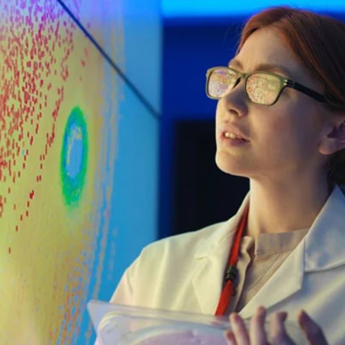 SOC Article Feature Image Marsico 2025 A scientist studies a projected scientific image on a screen.