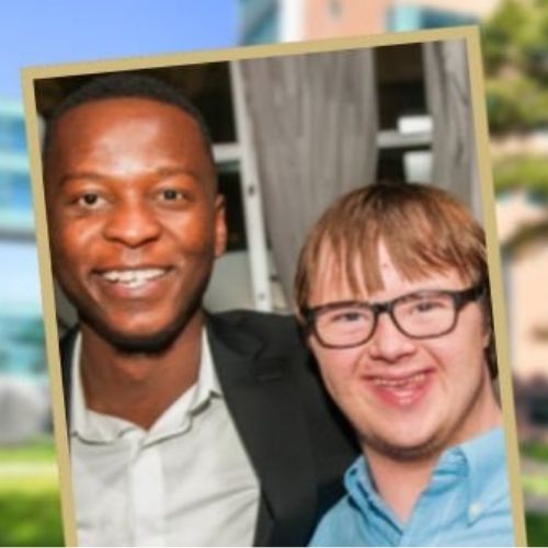 SOC Article Feature Image Sie Founation A doctor and patient with down syndrome pose happily for a picture together.