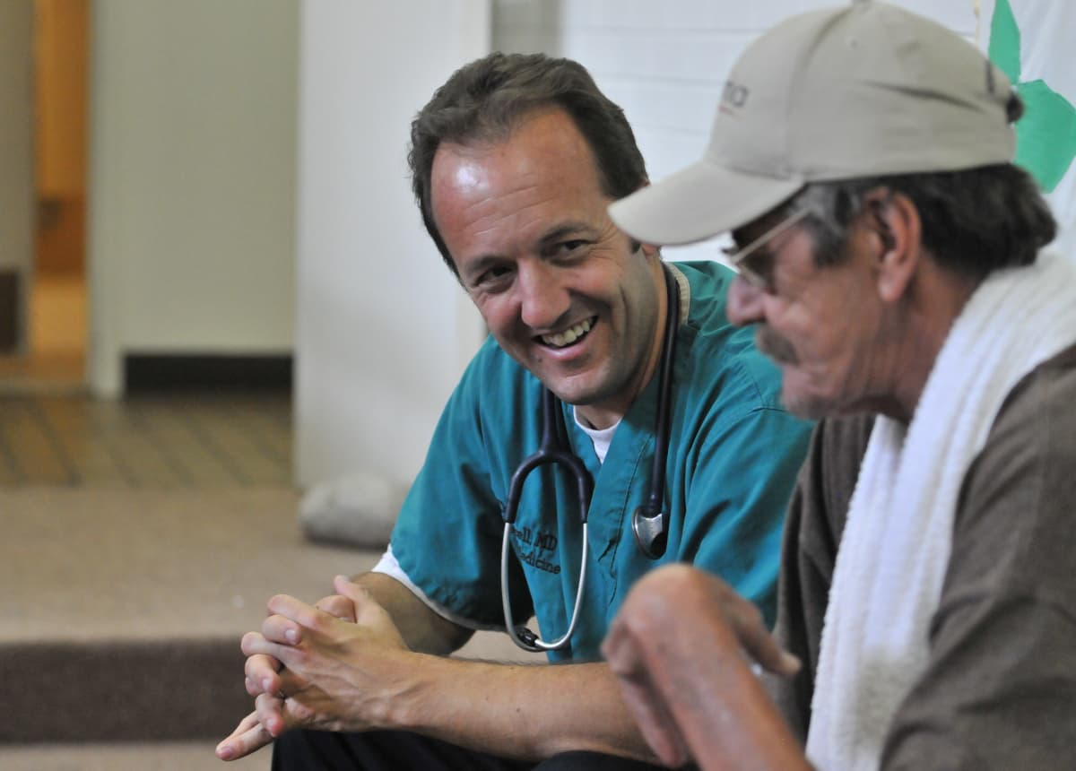 Nursing student working with patient