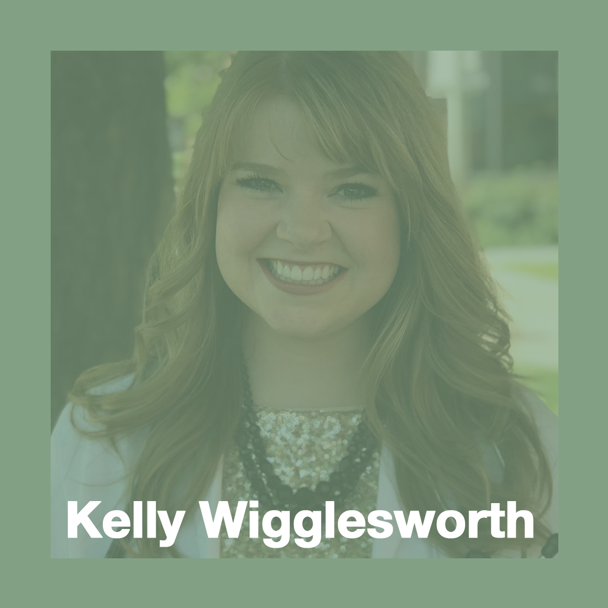 Kelly Wigglesworth, medical scholar. She is wearing a gold sequin shirt and a black necklace, as well as a white medical coat, and is smiling at the camera.