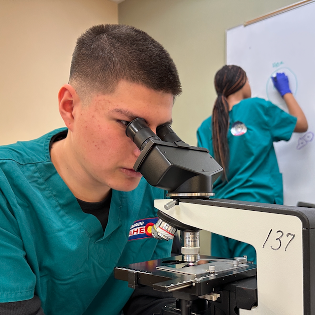 Student at Microscope