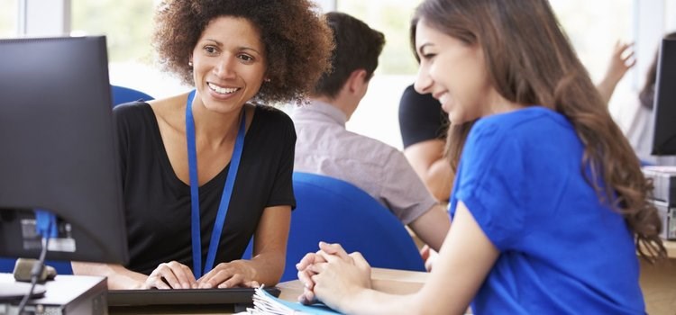 Advisor at computer with student