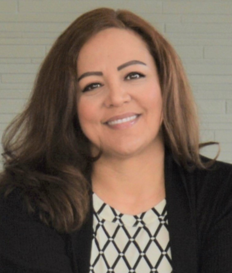 Picture of Gabriela Jacobo smiling in front of a white background