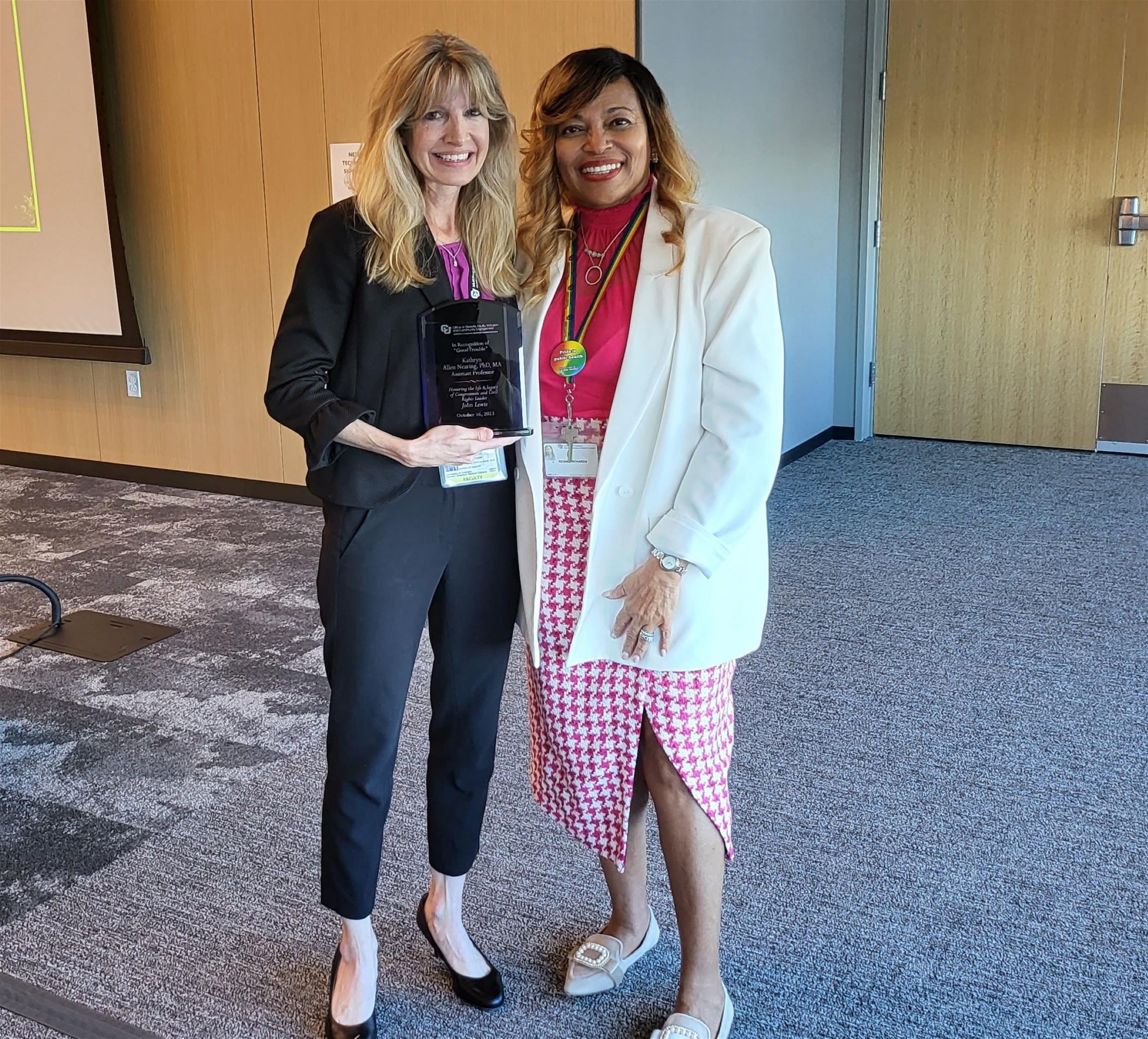 Good Trouble Award winner Kathryn Nearing poses with her award