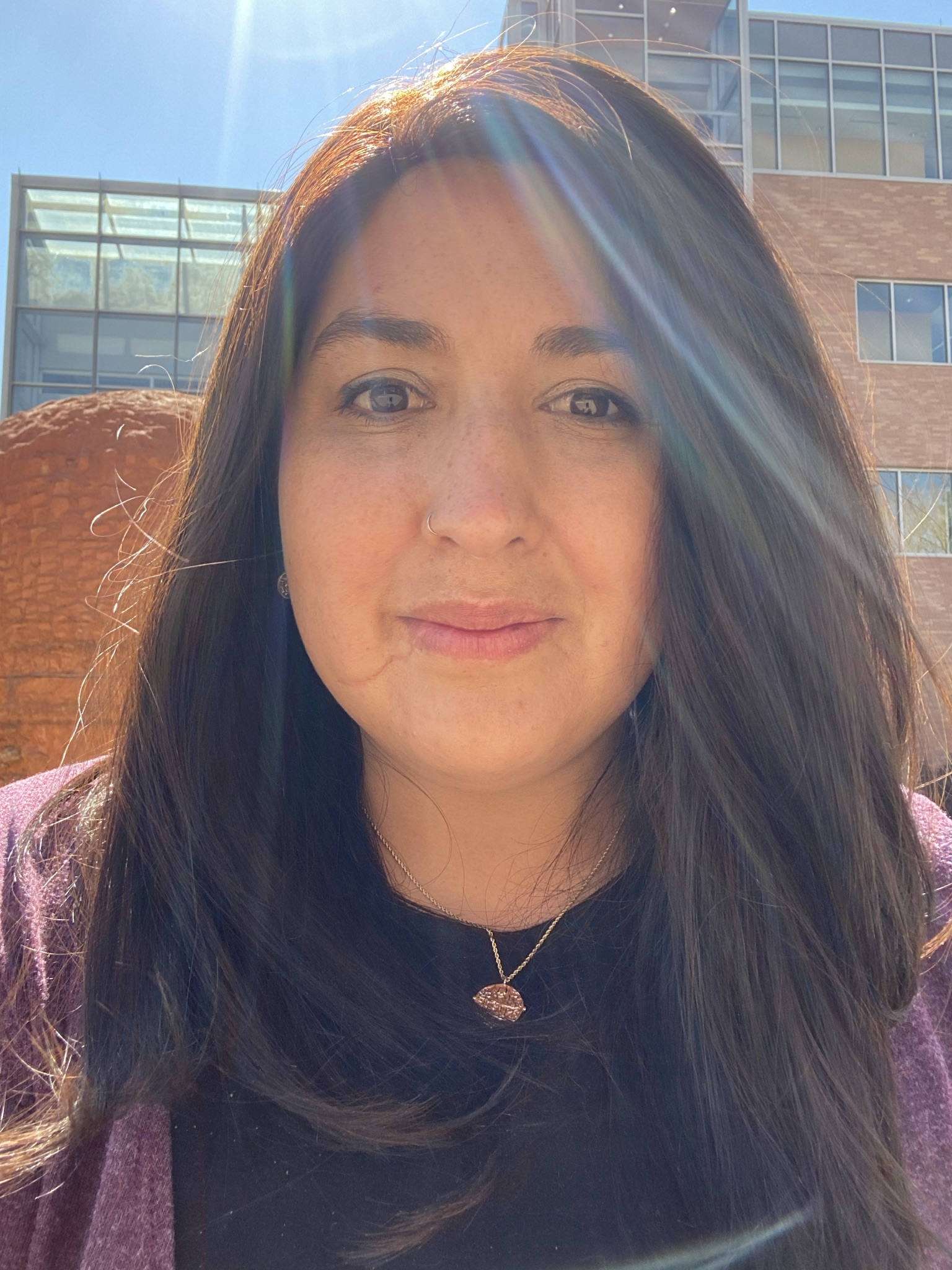 Picture of Christy Angerhofer smiling in an outdoor setting