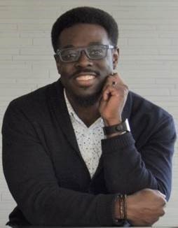 Picture of Jameel Mallory smiling in front of a white background