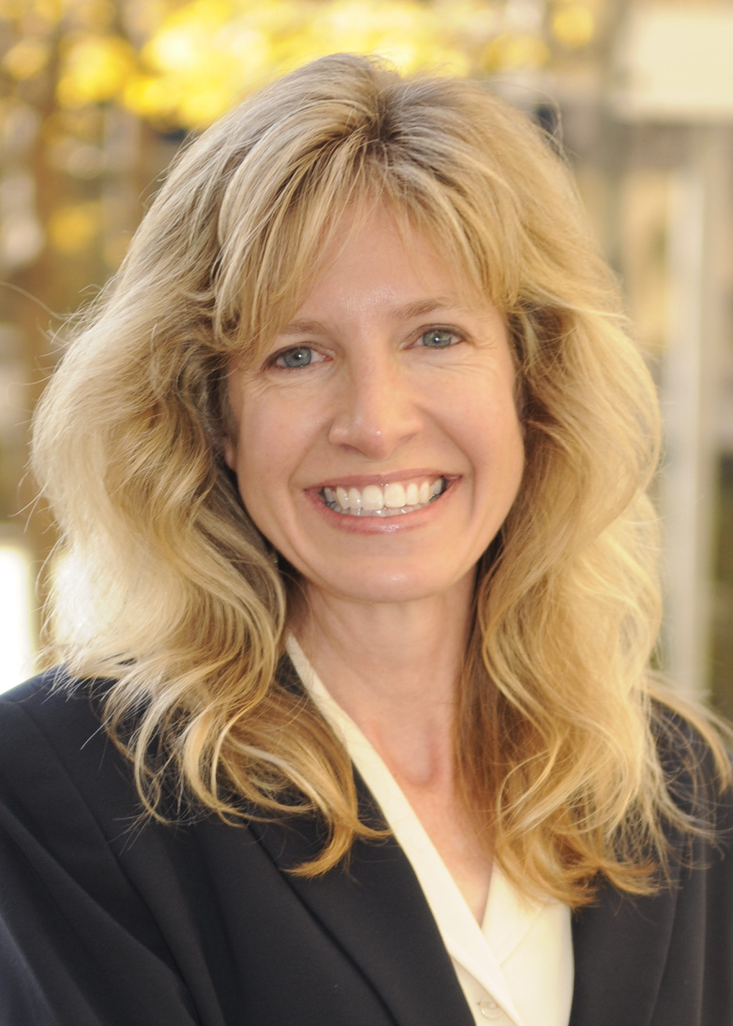 Picture of Kathryn Nearing smiling in an outdoor setting