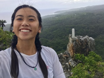 claire smiling in front of rocks