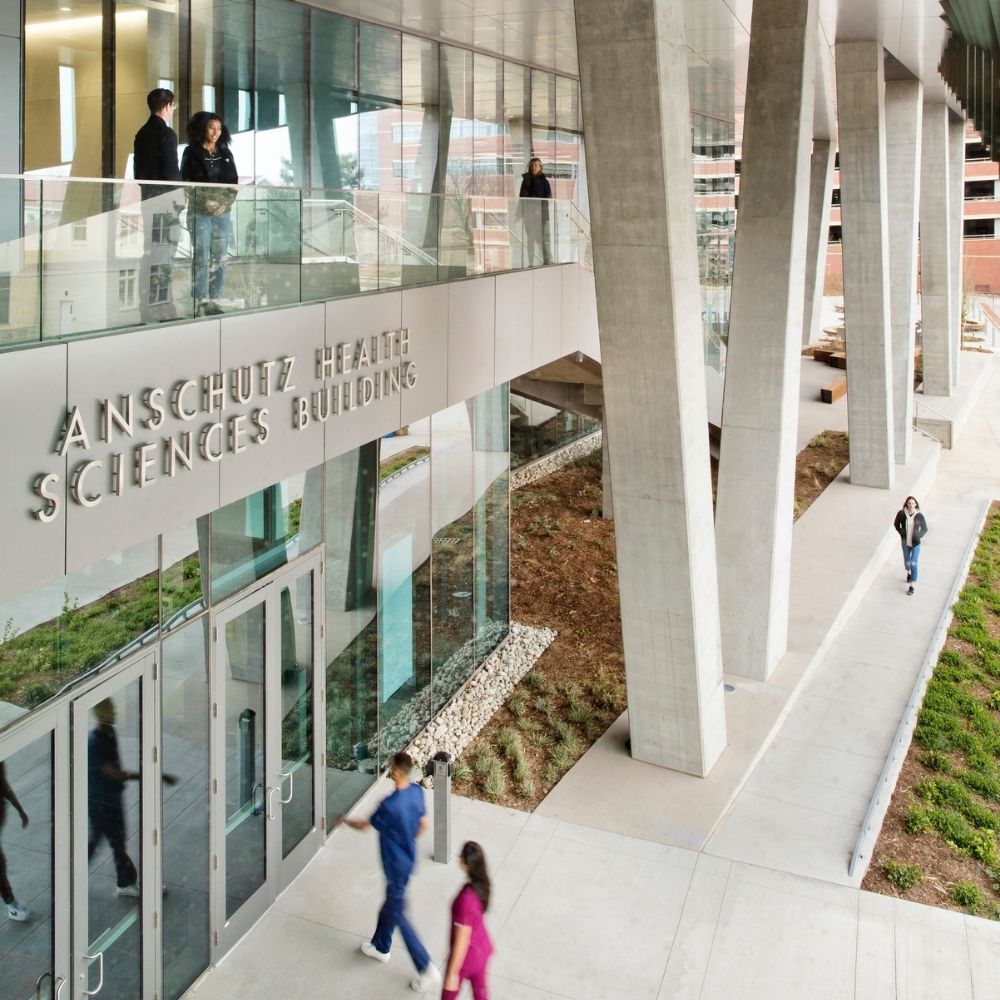 A view of students walking into the Anschutz Health Sciences building.