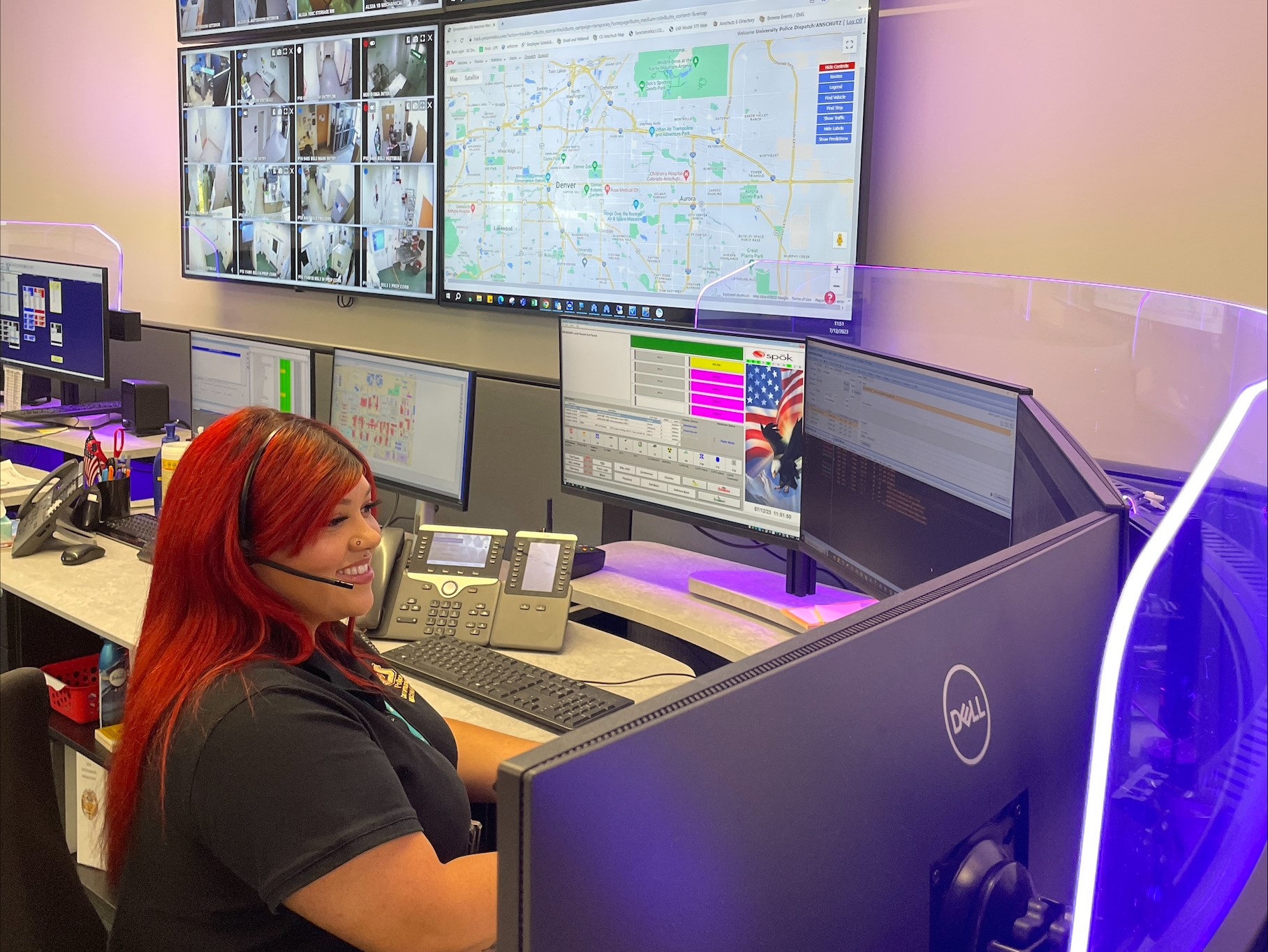 Female dispatcher at desk with computers Looking Right with Light Panel (2)