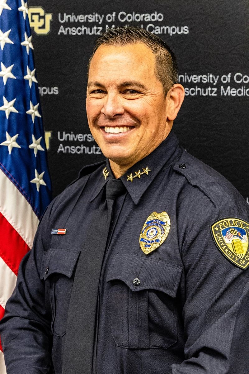 Matthew D. Harris portrait in uniform in front of the US flag.