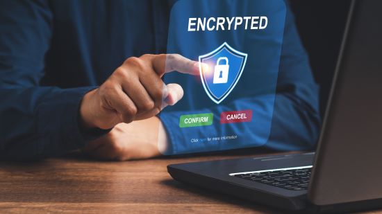 Encrypted stock image Photo of a finger clicking on an encrypted secure logo.